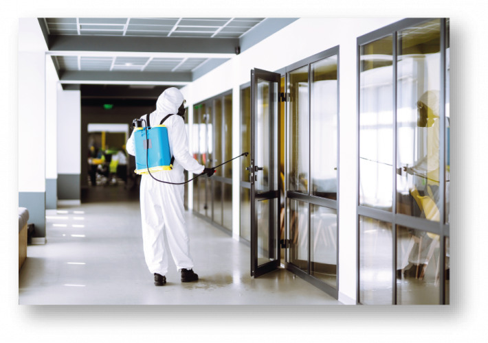 Image of person in bio-hazard cleaning outfit cleaning an office