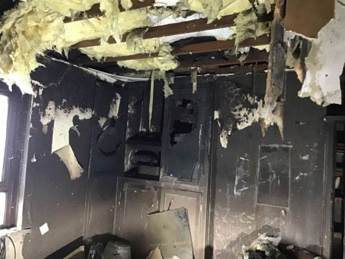 Image of a fire damaged room with a collapsed ceiling