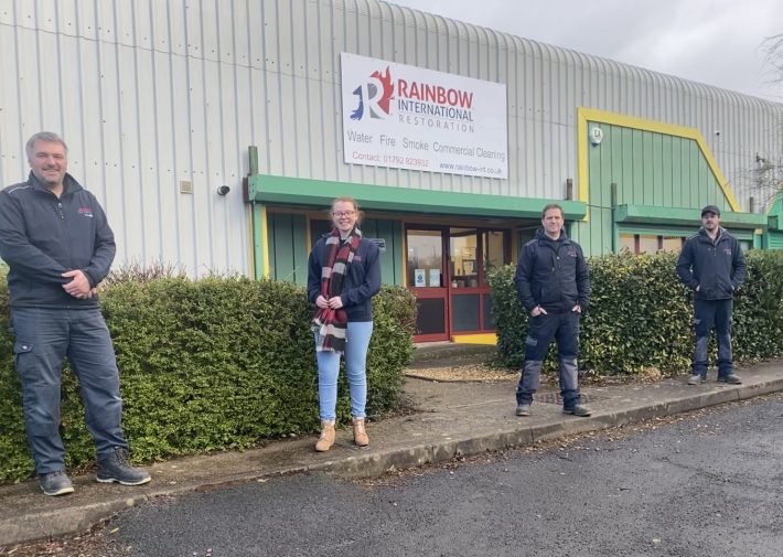 Image of four staff members stood outside a Rainbow unit